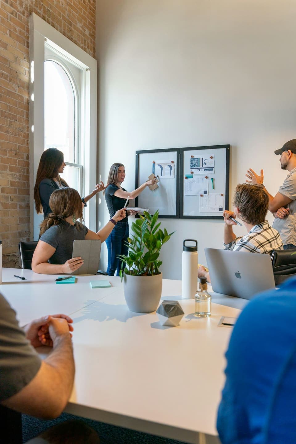 A team planning together around a table in a bright office